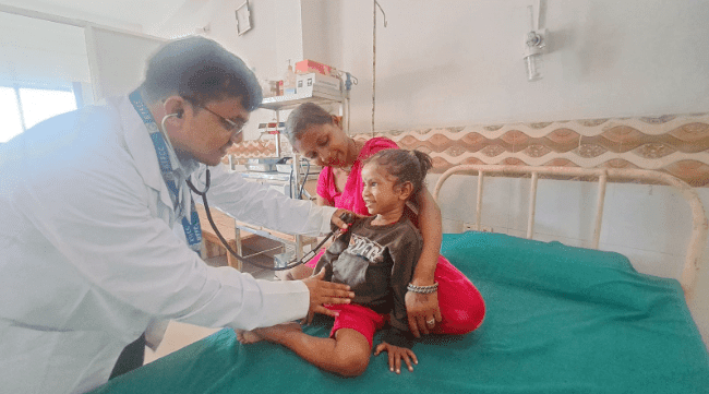 A young patient receives treatment at the Binaytara Cancer Center in Nepal, part of a global oncology effort to reduce cancer disparities and improve health equity.