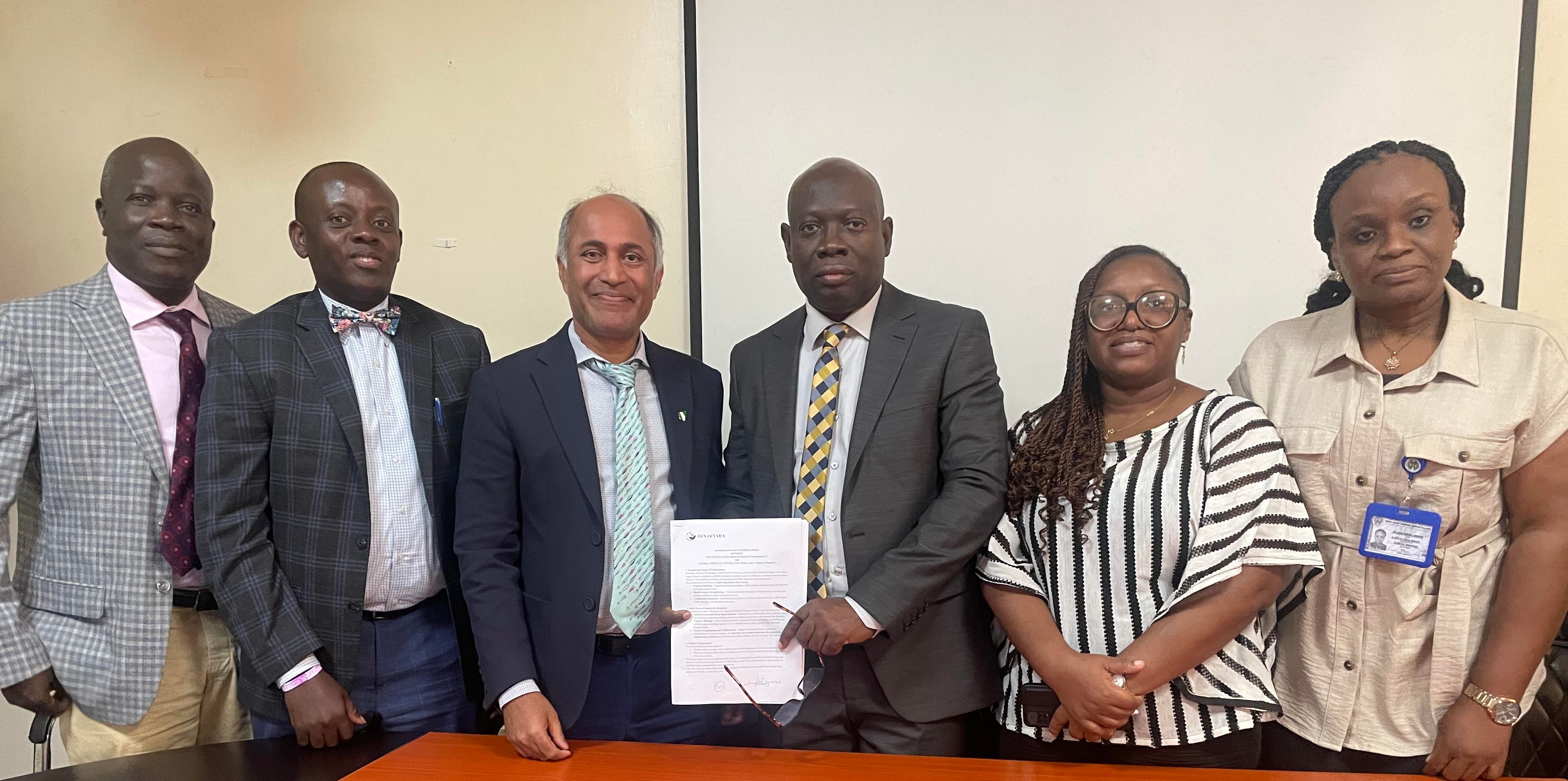 Dr. Binay Shah with leaders of FMC Ebute Metta and Redeemer’s Health Village holding a signed memorandum of understanding in Lagos, Nigeria.