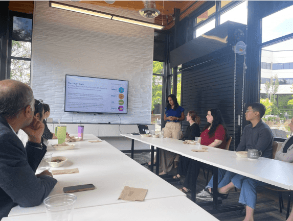 Dr. Raquel Sanchez presents global oncology strategies to Binaytara staff, highlighting efforts to reduce cancer disparities and promote cancer equity.