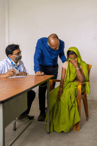 Dr. Binay Shah comforts a patient during a Binaytara cancer health disparities outreach clinic focused on global oncology and equitable care.