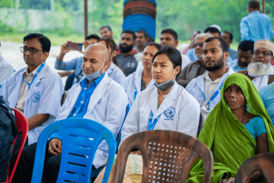 Doctors, healthcare professionals, and community members attending a cancer awareness and outreach event in Nepal.