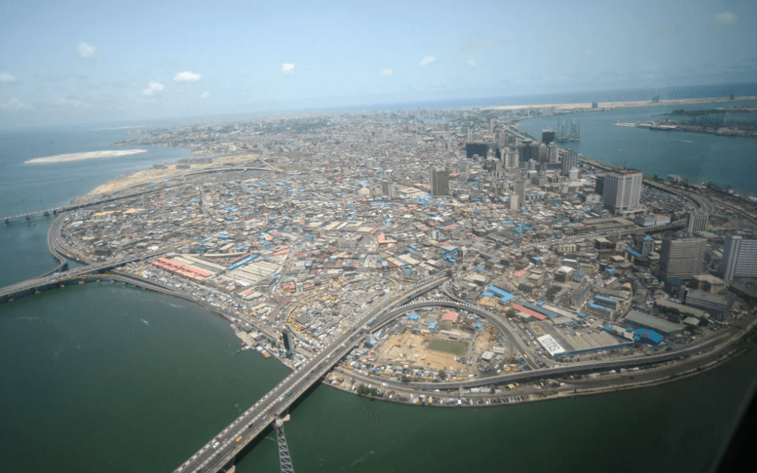 Aerial view of Lagos State, Nigeria, showing bridges, coastline, and cityscape.