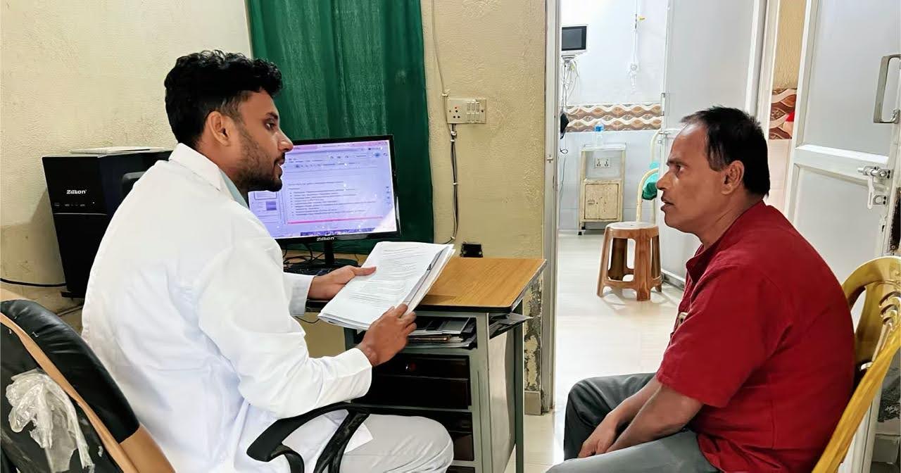 Dr. Bablu Yadav, medical officer at Binaytara Cancer Center, consulting with Mr. Mishra about treatment
