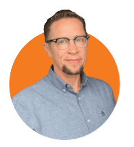 Portrait of Dr. Scout, Executive Director of the National LGBT Cancer Network, against an orange background