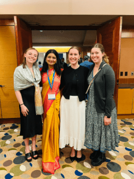 Emma Robinson with Binaytara team members at the SCHD25 conference