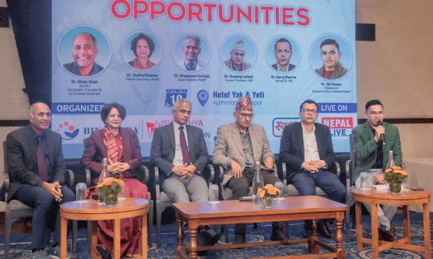 Panel of healthcare leaders and policymakers at the Binaytara and Swasthya Khabar Foundation policy debate on health insurance in Nepal, held at Hotel Yak & Yeti in Kathmandu.