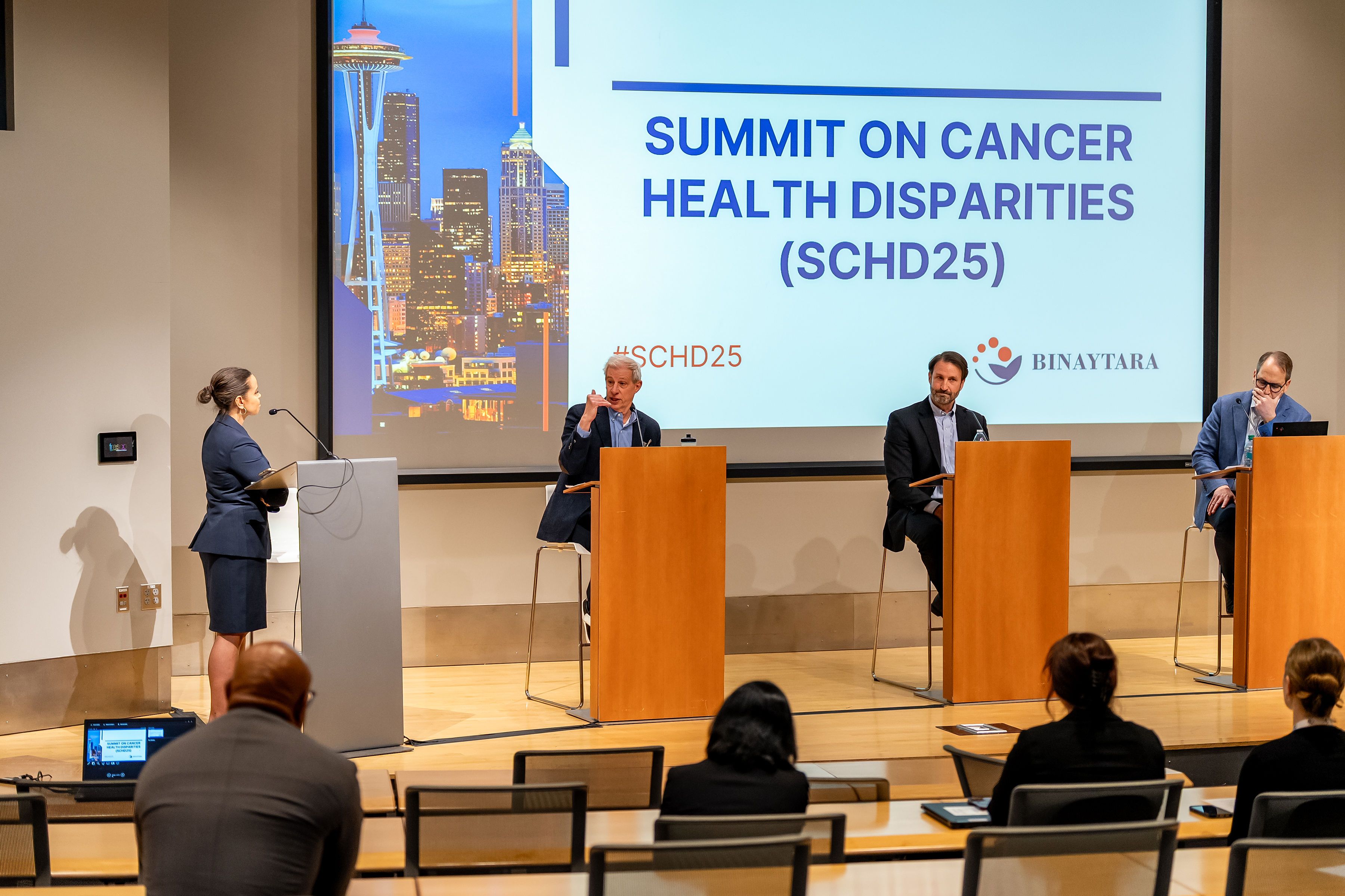 Dr. Larry Kessler, Dr. E. Anders Kolb, and Dr. Alan Balch speak during the SCHD25 healthcare debate moderated by Anne-Marie Green