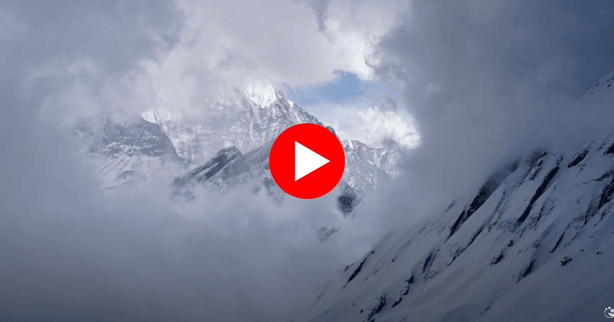 Snow-covered Annapurna mountain peak emerging through clouds, thumbnail for Binaytara’s 2025 cancer awareness trek video.